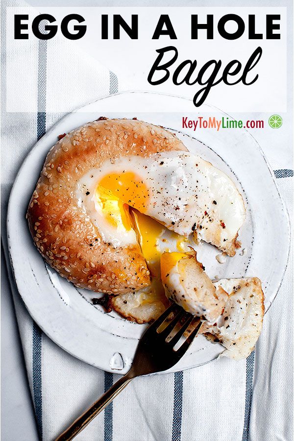Egg in a hole bagel on a plate.