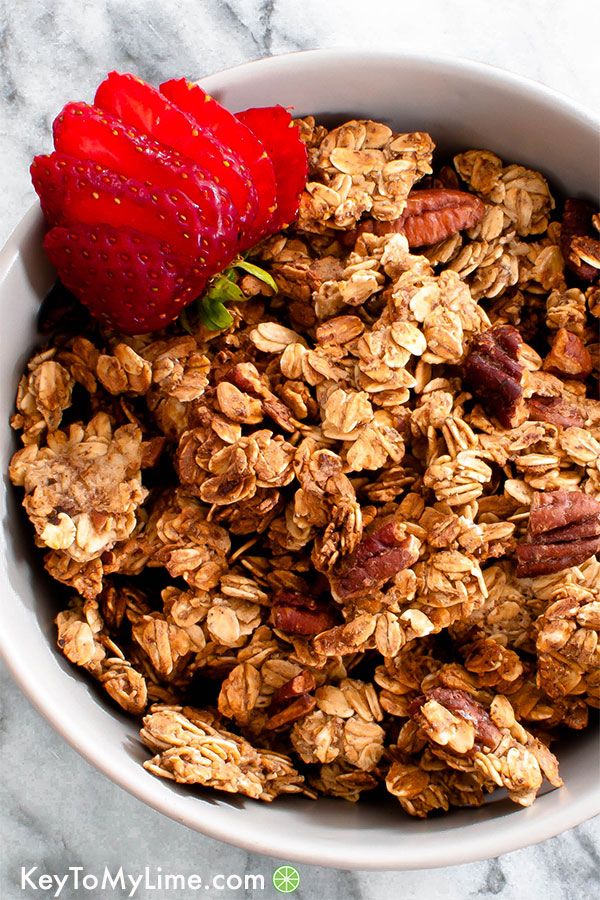 Vegan oil-free granola with sliced strawberry in a bowl.