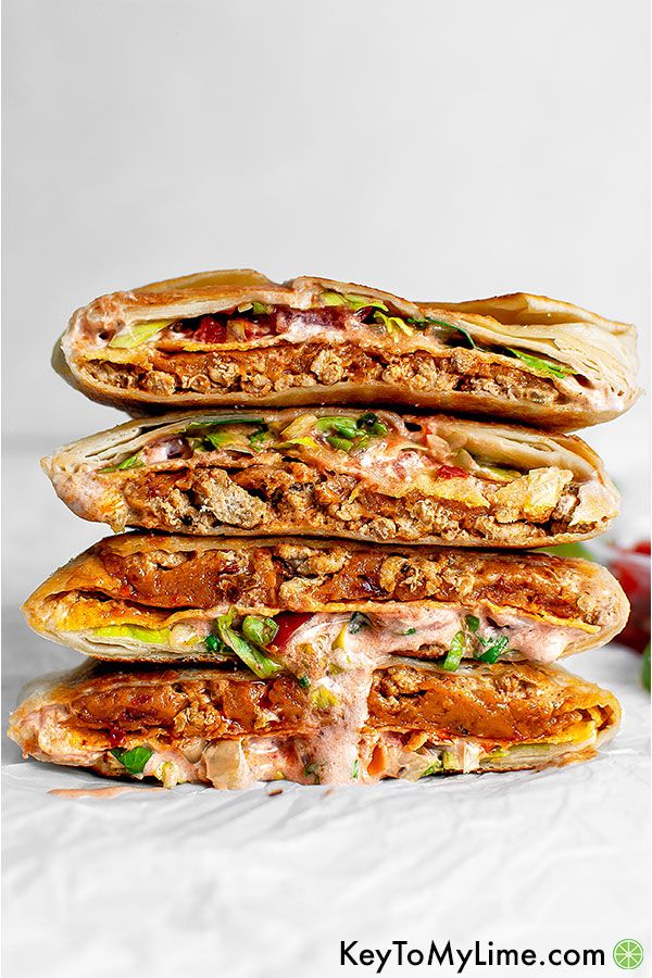 Four halves of two crunchwraps in a stack.