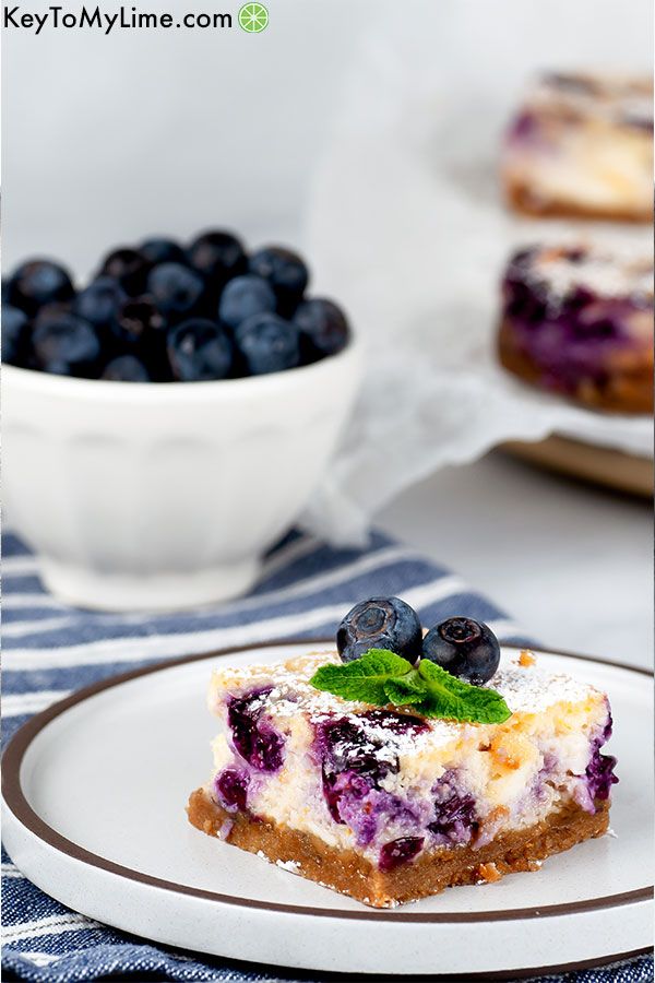 Blueberry cheesecake bars with a gluten free graham cracker crust.