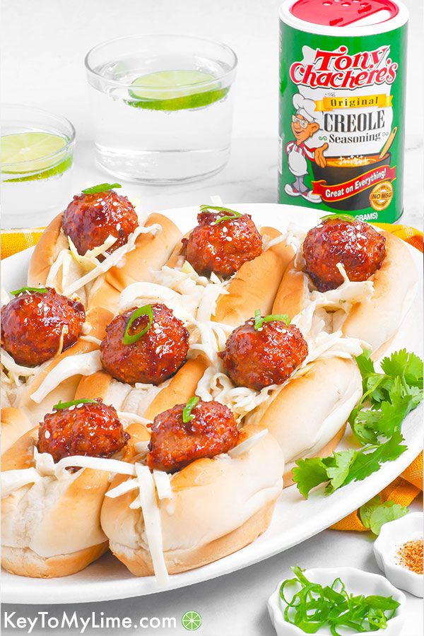 A side image of bbq meatball sliders on an oval platter.