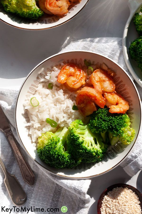 Honey garlic shrimp in a bowl with natural afternoon light shining on it.