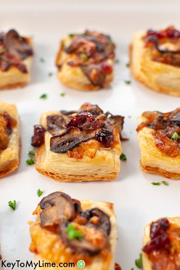 A tray full of mushroom puff pastry appetizers.