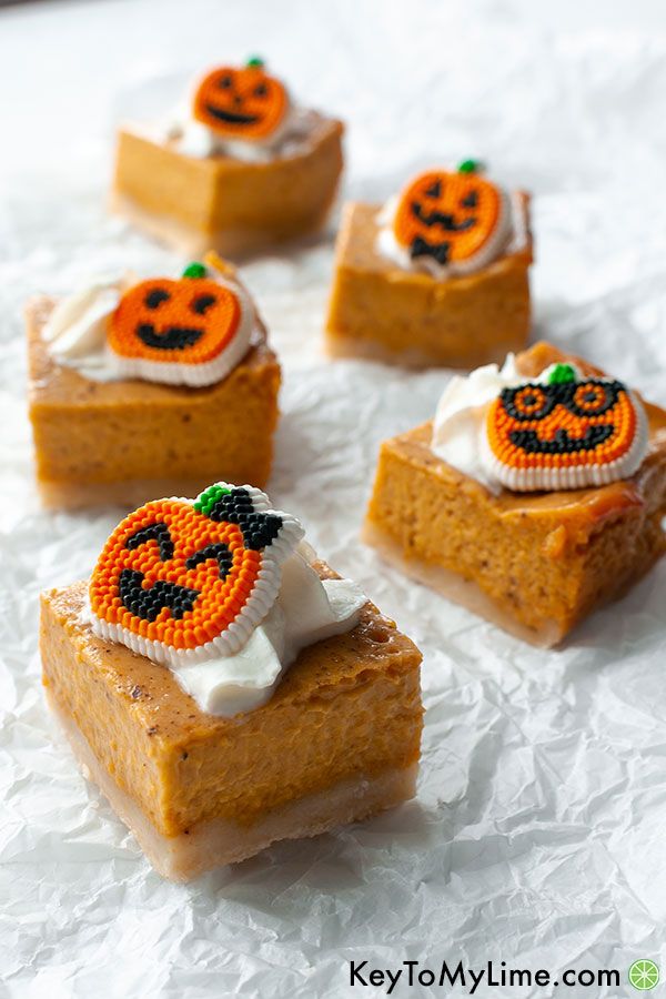 Pumpkin pie bars topped with candy pumpkins.