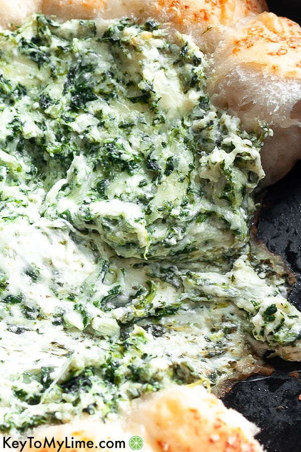 A close up image of hot spinach dip.