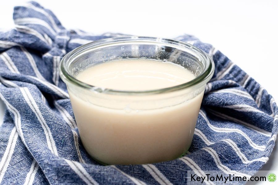 A side image of plant based buttermilk in a jar.