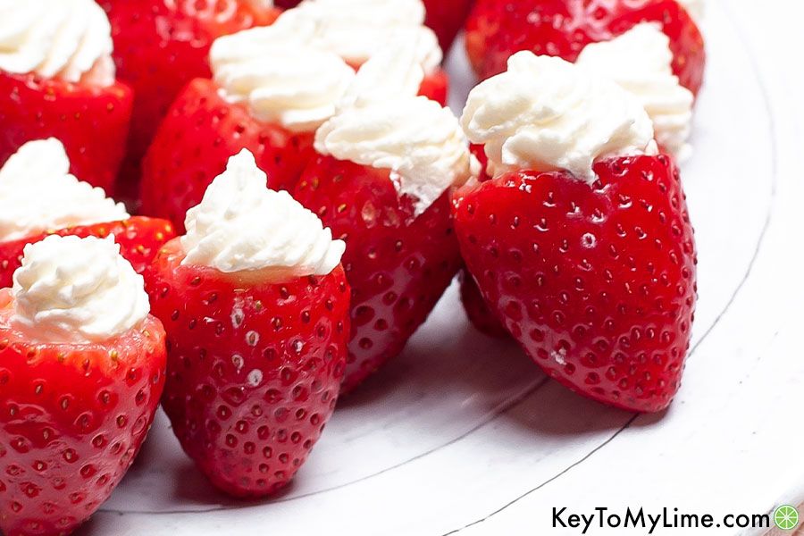 A close up image of keto cheesecake stuffed strawberries.