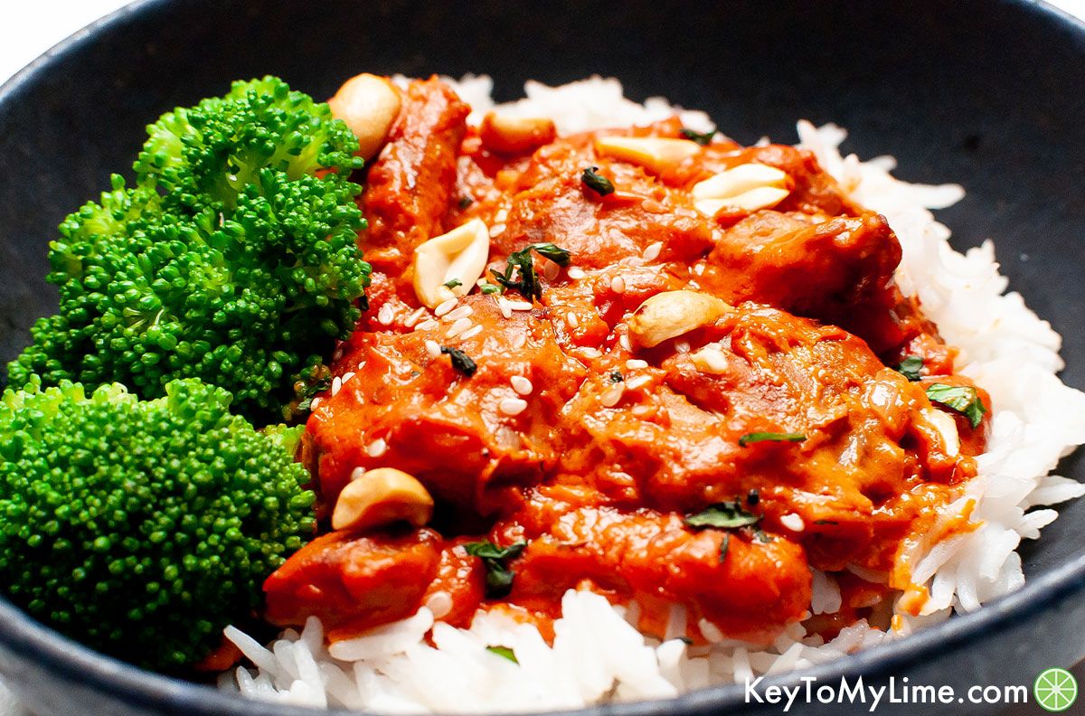 Peanut butter chicken served with rice and broccoli.