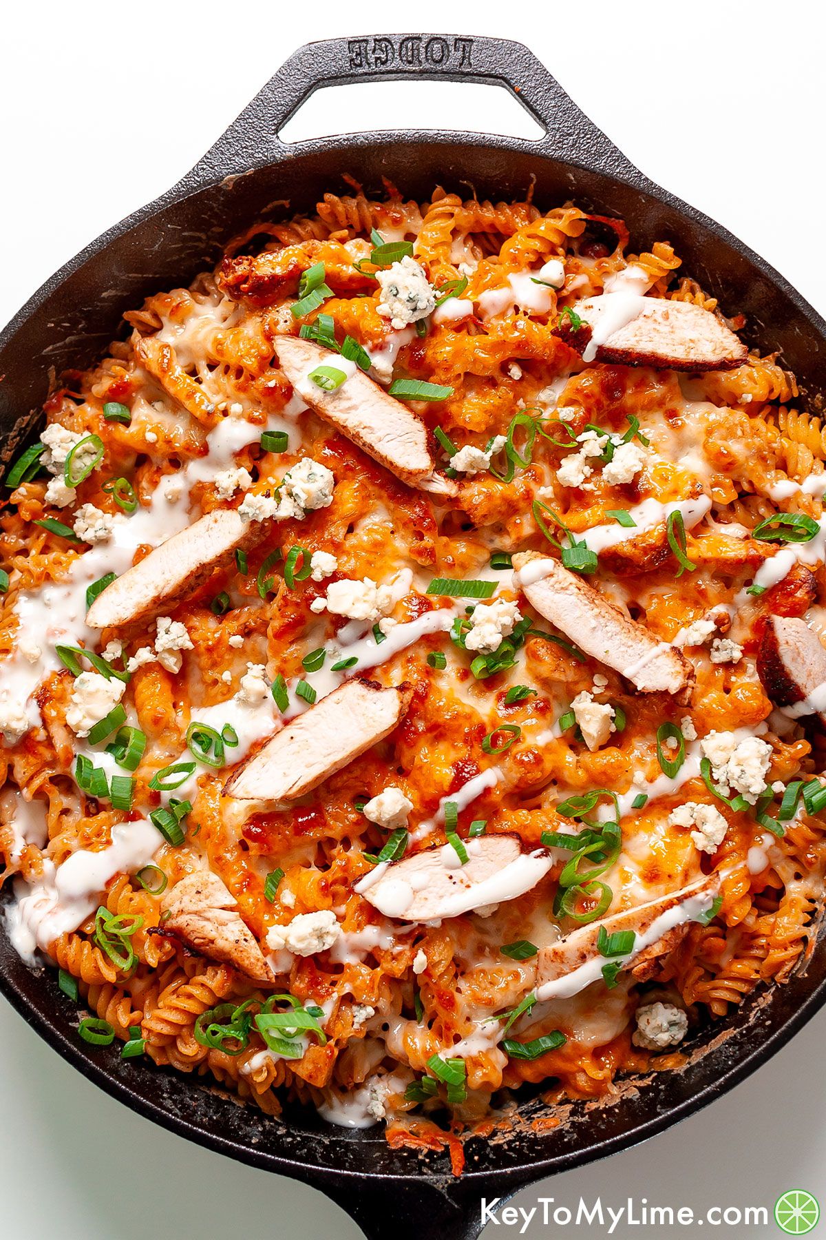 Buffalo chicken pasta topped with blue cheese dressing.