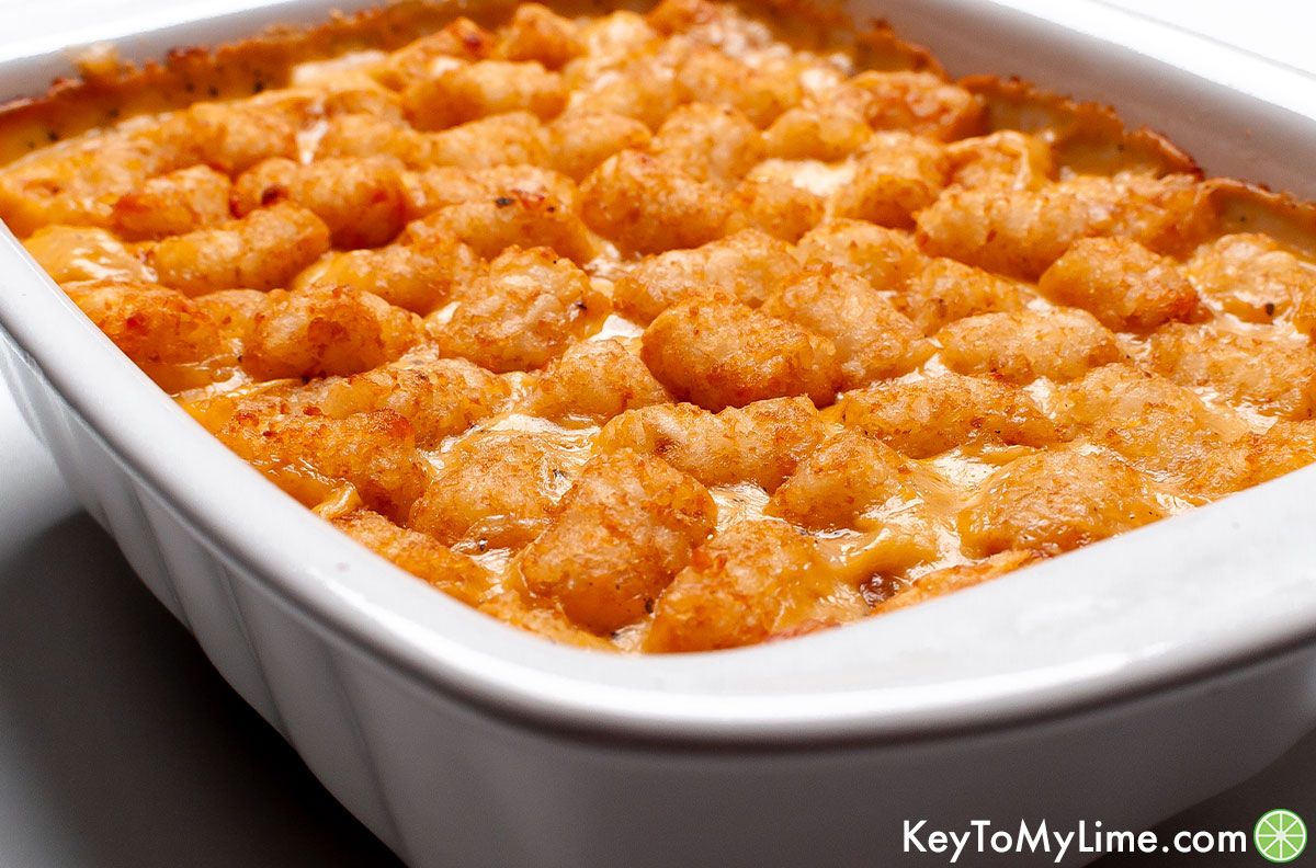 A side image of a cheesy chicken tater tot casserole.