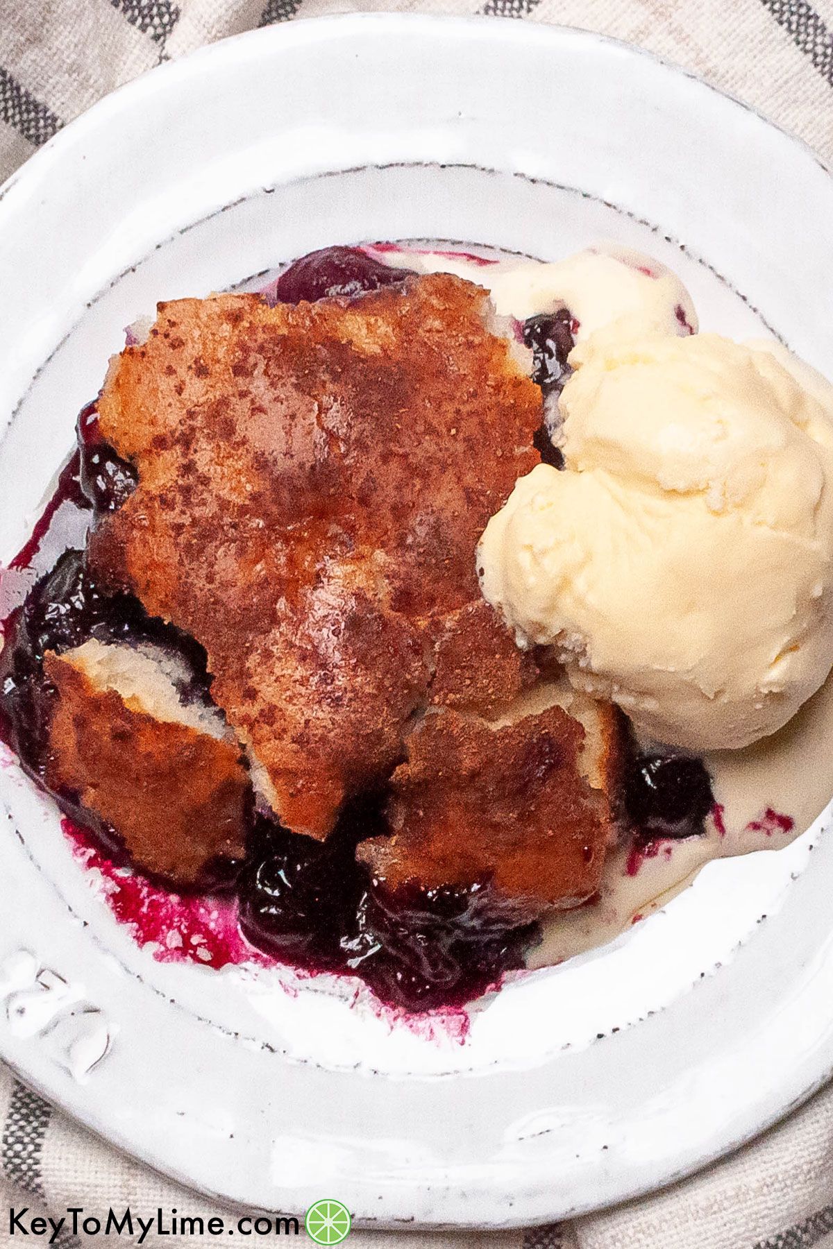 A plate of Bisquick blueberry cobbler.