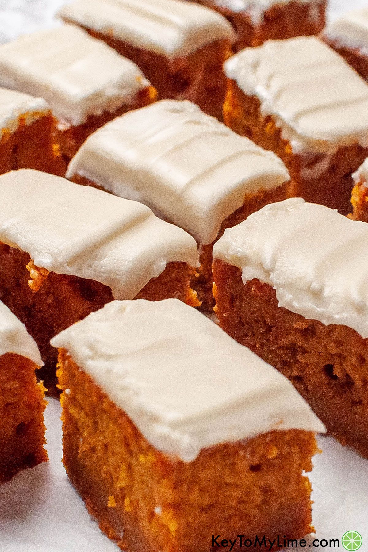 A close up image showing the inside texture of the pumpkin cake bars.