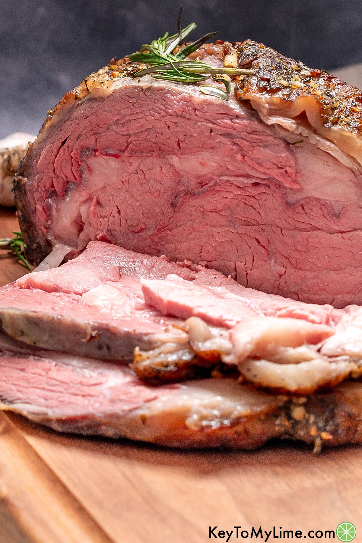 A close up image of a sliced prime rib roast showing the inside texture.